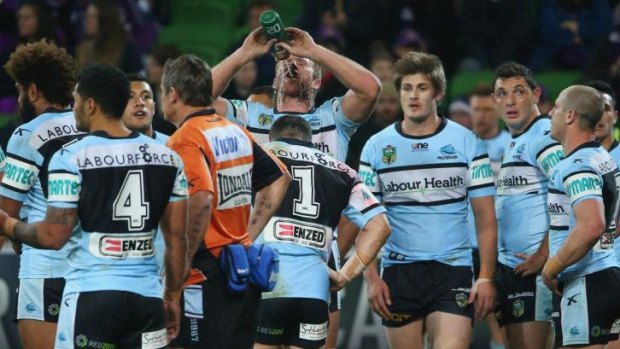 Season to forget: Dejected Sharks players after conceding another try against Melbourne on Saturday.