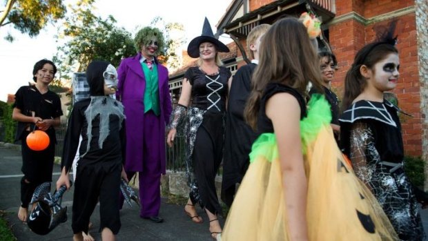 Brad and Phoebe Steyn go trick or treating with their children and others from their neighbourhood.