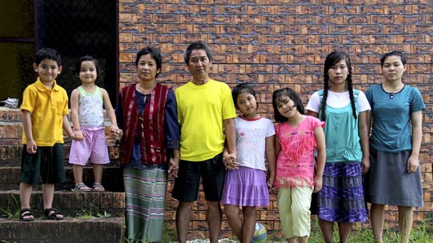Hser Paw, 44, and her husband Laythaw, 45, with their children Zoa, 5, Pawtharsher, 4, Pawthathaw, 9, Pawthashue, 8, and nieces Kuheh, 20 and Hteedoh, 20, at their Loganlea home, south of Brisbane.