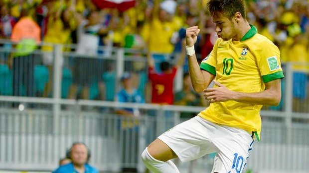 Barcelona-bound Neymar celebrates after scoring against Italy for Brazil.
