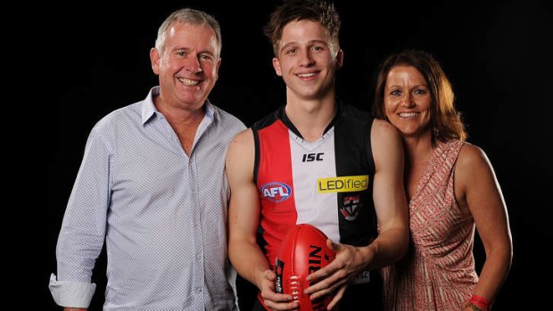 Jack Billings poses for a photograph with his father Graeme and mother Letitia.