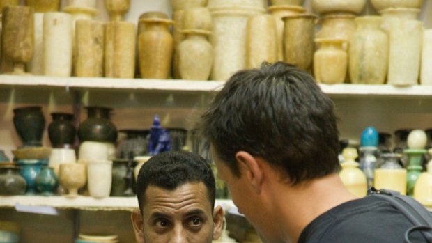 Haggling in the souvenir shop in Luxor market, Luxor, Egypt.