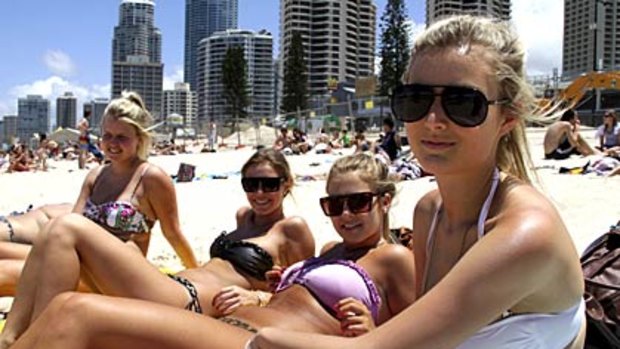 Renee Nourse, 17, Elly Thomas, 17, Holly Moore, 17, and Brittany Dwyer, 18, all from Sydney, catch some sun at Surfers Paradise.