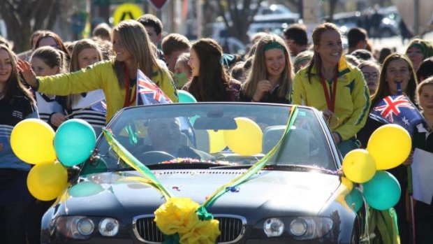 Kellie White and Emily Smith were honoured with a street parade in their home town of Crookwell on Friday after winning a gold medal with the Hockeyroos at the 2014 Glasgow Commonwealth Games.