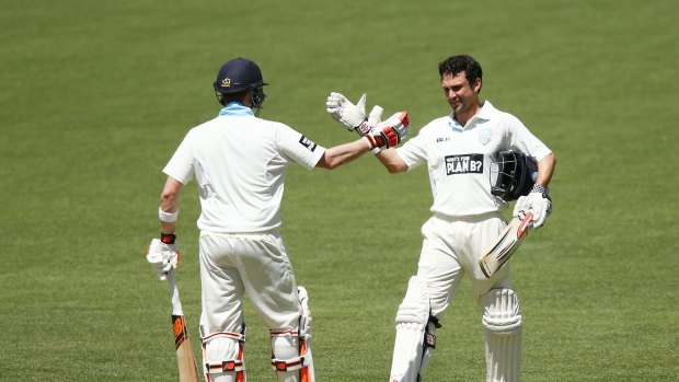 Waiting in the wings: Ed Cowan (right) celebrates his century against South Australia.
