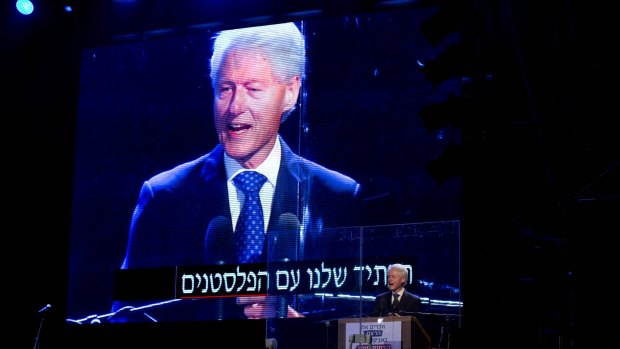 Former US President Bill Clinton speaks during a rally marking 20 years since the assassination of the late Israeli Prime Minister Yitzhak Rabin.