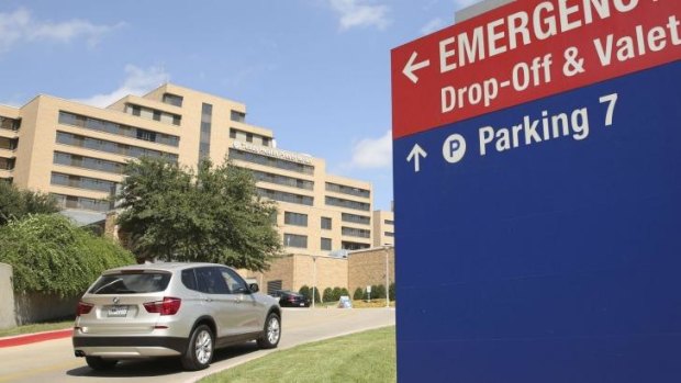 A vehicle drives up the driveway to the Texas Health Presbyterian Hospital in Dallas.