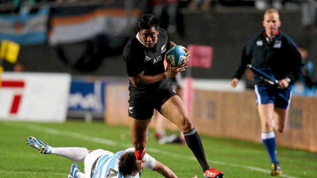 Julian Savea of the All Blacks breaks clear of Julio Farias Cabello to score the opening try.