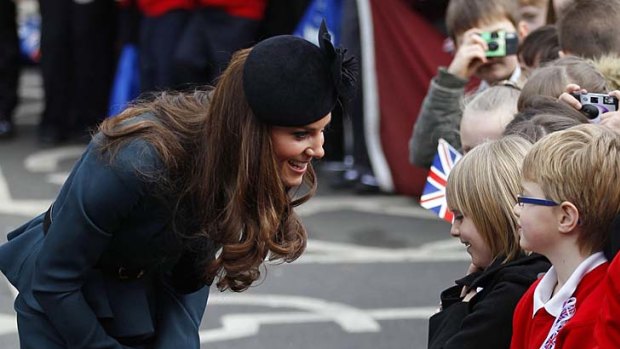 Crowd favourite ... Catherine, Duchess of Cambridge, speaks to school children.