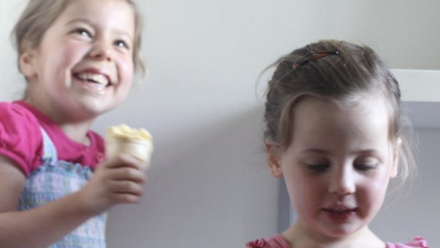 Nelly, 5, and Jane, 2, devour their treats, in this case banana, pineapple and mango ice-cream.