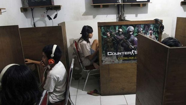 Indonesian youths browse at an internet cafe in Jakarta.