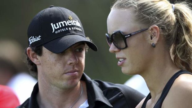 Glamour pair: Rory McIlroy, the world's No. 1 golfer, and tennis star Caroline Wozniacki have arrived in Brisbane in the lead-up to next month's Australian Open.