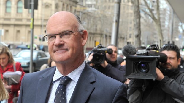 Simon Cooper leaves the Melbourne Magistrates' Court after pleading guilty to child sex charges in August 2013.