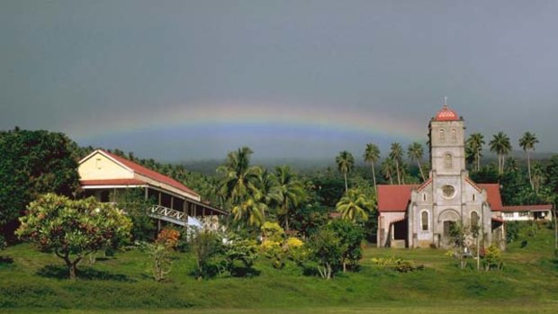 Pacific paradise ... a Catholic church in Taveuni is framed by dense greenery.