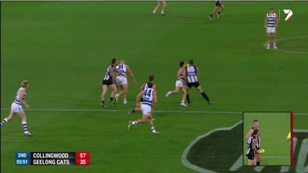 Collingwood's Darren Jolly collides with Geelong's Mathew Stokes.