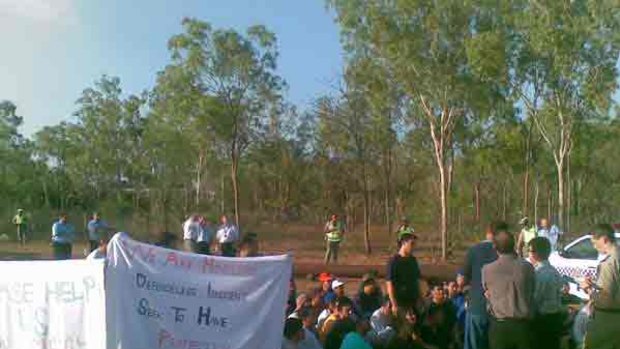 The escaped Afghan detainees stage a protest on the side of the Stuart Highway.