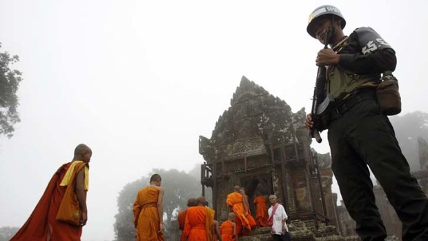 Monks enter the ruins of the Preah Vihear temple.