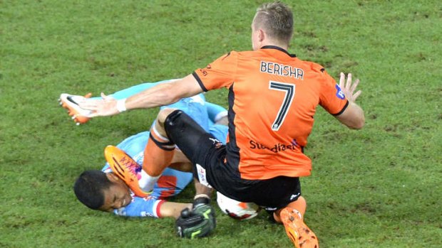 Besart Berisha of the Roar is given a red card by referee Chris Beath for this challenge on Robbie Wielaert of the Heart.