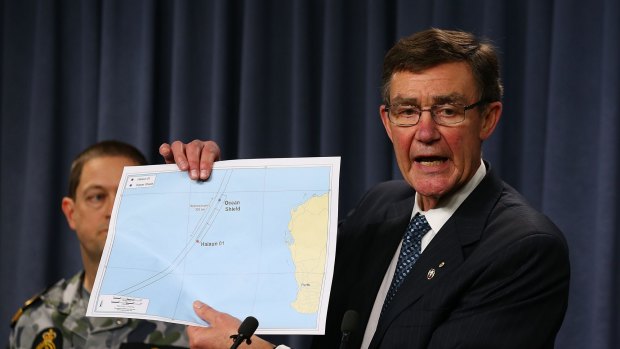 Houston briefing media during the search for MH370 last year.