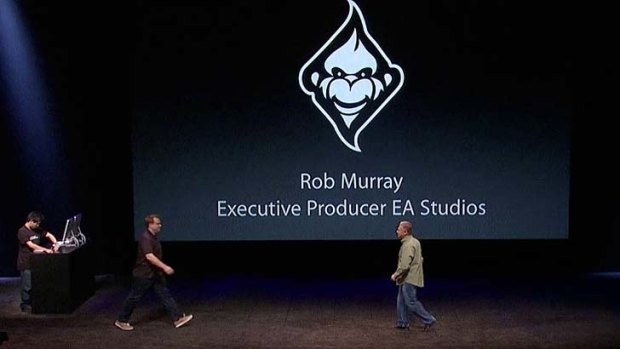 Rob Murray is greeted on stage by Apple's senior vice president of worldwide product marketing, Phil Schiller.