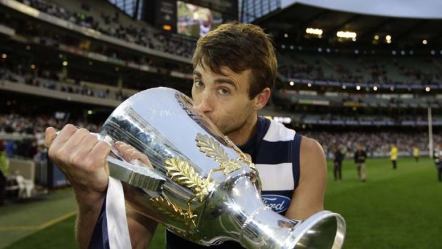 More silverware: Corey Enright kisses the premiership cup after Geelong's grand final.
