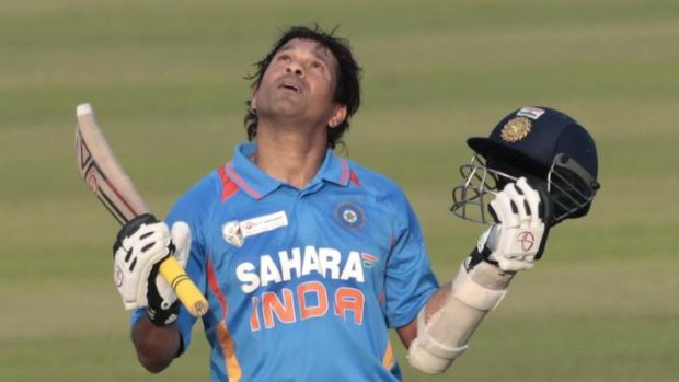 India's Sachin Tendulkar celebrates after he scored his 100th centuries.