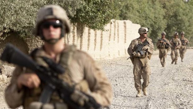 U.S Marines of Weapons Company, 1st Battalion, 3rd Marines patrol outside Camp Gorgak in Helmand province, southern Afghanistan.