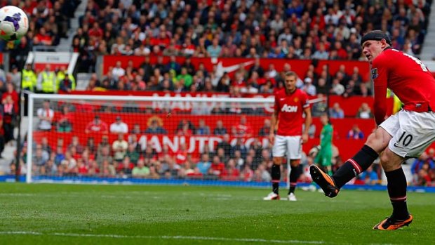 Wayne Rooney scores his team's second goal from a free kick.