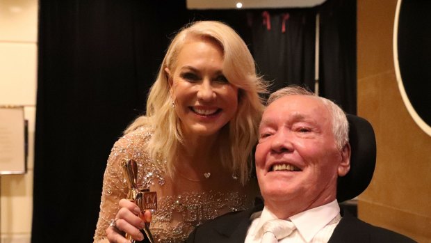 Kerri-Anne Kennerley and her husband John pose with the Hall Of Fame Logie Award.