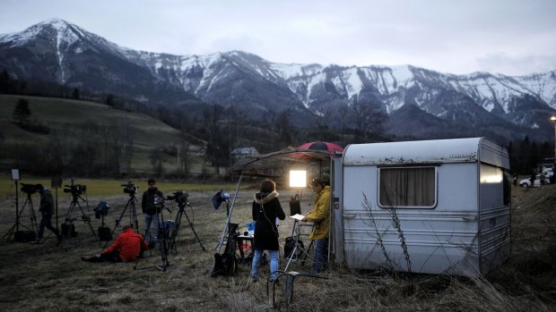 Video reporters work in Seyne les Alpes on Tuesday.