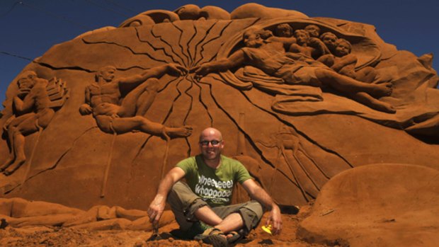 Wilfred Stijger with his sculpture on Frankston beach.