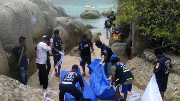 Thai police work near the bodies of two British tourists murdered on Koh Tao.