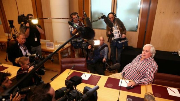 Holding court: Clive Palmer addresses the media.