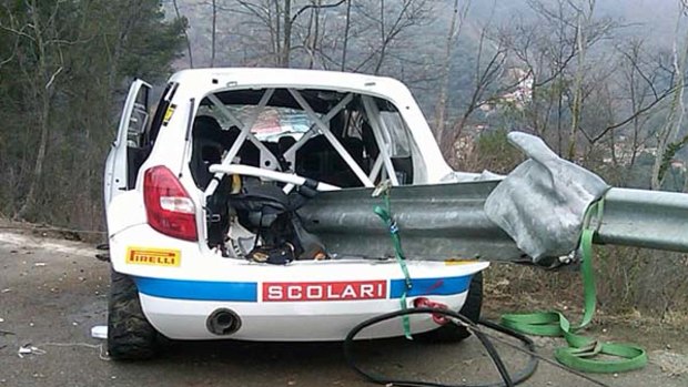 A piece of guard rail through the wrecked Skoda car of Polish formula one driver Robert Kubica.