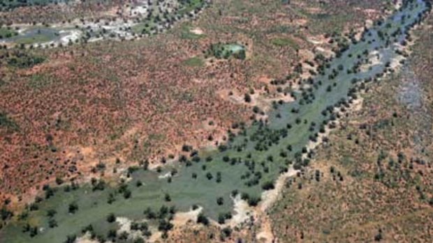 Hope returns ... the rivers are full but residents near Wanaaring, north-west of Bourke, need supplies from the SES.