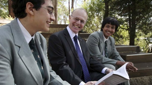 Testing: Dr Neil Peters with year 12 students Ramsay Aoude and Jay Banerji.