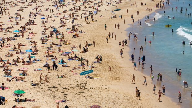 Summer crowds on the sands of Bondi Beach. 
