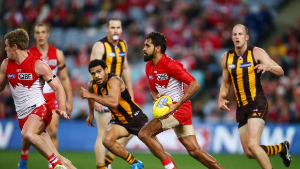 Looking ahead: Lewis Jetta gazes upfield during the round 16 AFL match between the Sydney Swans and the Hawthorn Hawks at ANZ Stadium.