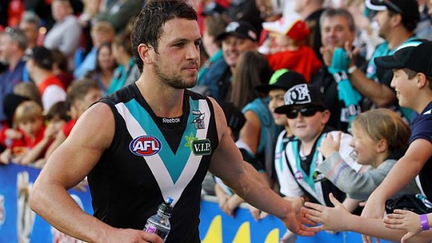 For how long will Travis Boak celebrate with Port fans?