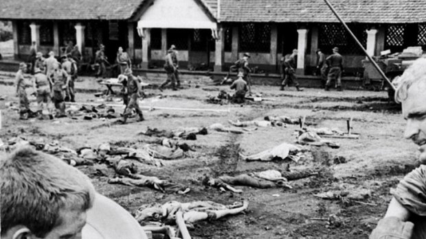 Killing field ... Australian soldiers Ken Wilson  and Laurie Sullivan  with the bodies of Vietnamese soldiers killed during the Battle of Binh Ba in June 1969.