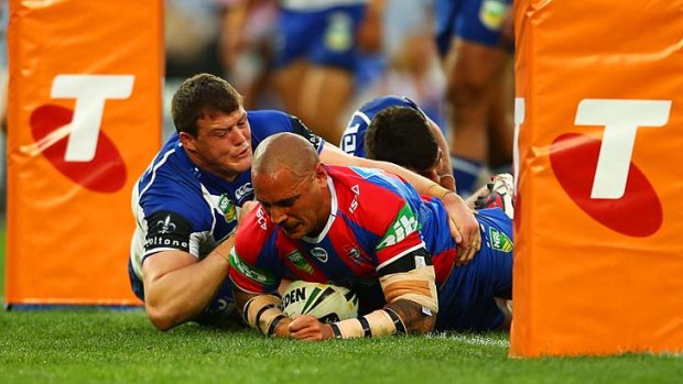 Jeremy Smith scores for the Knights at ANZ Stadium on Sunday.