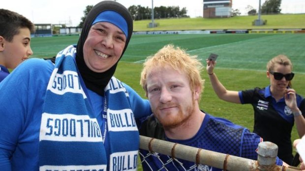 Diehard fan: Salam Al-Chami with Bulldogs forward James Graham.