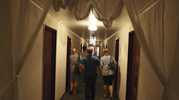 Digs in short supply ... ANU  student   representatives inspect motel rooms  where new students are to be offered subsidised housing.