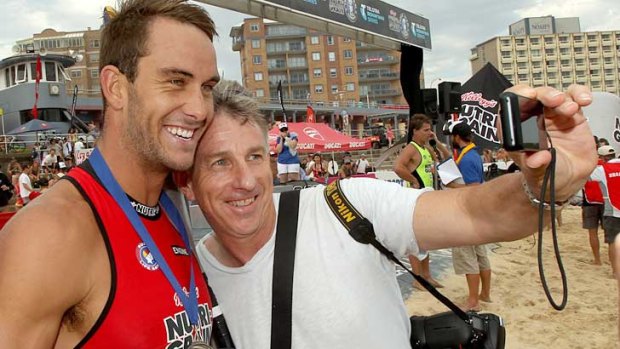 Ironman Matt Poole with  Eddie 'Groover" Cross who crashed a TV interview so he could get a 'selfie'.