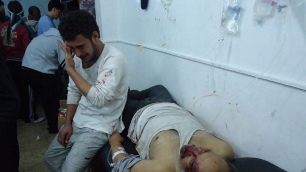 Wounded men in the district of Bab Amro in Homs.