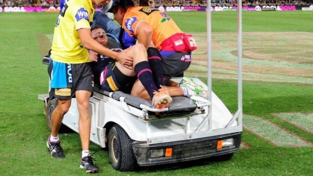 Cowboys forward Gavin Cooper is taken from the field against the Roosters.