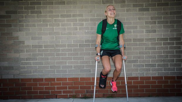 Canberra United's Nicky Flannery is in good spirits even though she is in a moon boot after being ruled out for the rest of the season. 