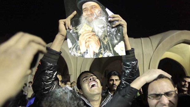 Egyptian Christian Copts mourn the death of Pope Shenouda III in Cairo.