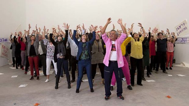 All together now ... artists join Anish Kapoor, front, to shoot a parody video of Psy's Gangnam Style in support of the Chinese artist Ai Weiwei, who was detained for criticising China on human rights.
