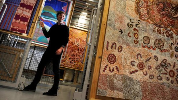 Assistant collection manager Adam Cullen in the indigenous section of National Gallery of Victoria archive.